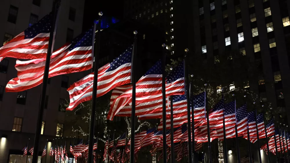 05 November 2024, US, New York: US flags decorate the Rockefeller plaza in Manhattan on the US Election Night. Photo: Apolline Guillerot-Malick/SOPA Images via ZUMA Press Wire/dpa