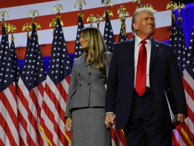 Republican presidential nominee and former U.S. President Donald Trump takes the stage with his wife Melania to address supporters at his rally, at the Palm Beach County Convention Center in West Palm Beach, Florida, U.S., November 6, 2024. REUTERS/Brian Snyder