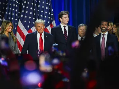 Republican presidential nominee and former U.S. President Donald Trump takes the stage with his wife Melania and his son Barron following early results from the 2024 U.S. presidential election in Palm Beach County Convention Center, in West Palm Beach, Florida, U.S., November 6, 2024. REUTERS/Callaghan O'Hare