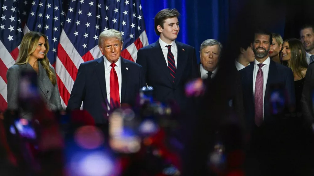 Republican presidential nominee and former U.S. President Donald Trump takes the stage with his wife Melania and his son Barron following early results from the 2024 U.S. presidential election in Palm Beach County Convention Center, in West Palm Beach, Florida, U.S., November 6, 2024. REUTERS/Callaghan O'Hare