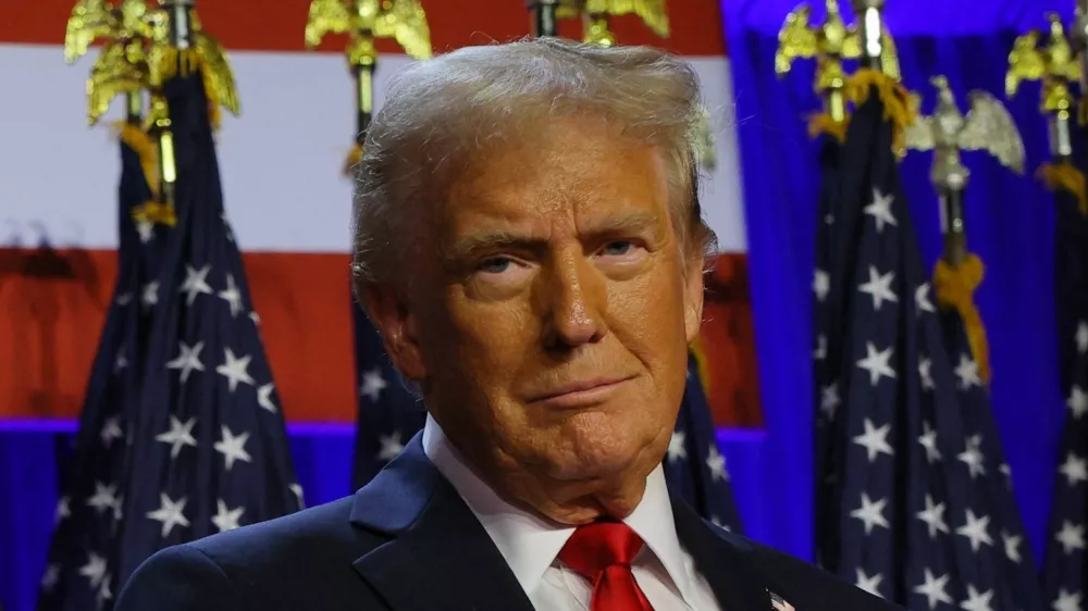 Republican presidential nominee and former U.S. President Donald Trump gestures as he stand on stage at his rally, at the Palm Beach County Convention Center in West Palm Beach, Florida, U.S., November 6, 2024. REUTERS/Brian Snyder