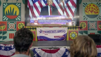 A screen shows live footage of Republican presidential nominee former President Donald Trump speech during a news program in Nairobi, Kenya, Wednesday, Nov. 6, 2024. (AP Photo/Brian Inganga)