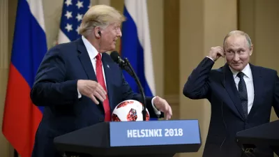 ﻿US President Donald Trump is presenetd with the official game ball of the FIFA World Cup 2018 from Russian President Vladimir Putin (R) during their joint press conference following their meeting at the Finnish Presidential Palace in Helsinki, Finland, 16 July 2018. Photo: Antti Aimo-Koivisto/Lehtikuva/dpa