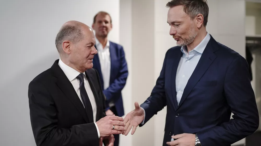 FILED - 26 February 2024, Berlin: German Chancellor Olaf Scholz (L) greets Minister of Finance Christian Lindner backstage at the Chief Editors' Conference 2024 in the dpa newsroom. Scholz has sacked Finance Minister Christian Lindner of the pro-business Free Democrats, a government spokesman told dpa on Wednesday evening, as Germany's troubled coalition government threatened to collapse. Photo: Michael Kappeler/dpa