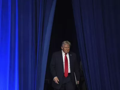 Republican presidential nominee former President Donald Trump arrives at an election night watch party at the Palm Beach Convention Center, Wednesday, Nov. 6, 2024, in West Palm Beach, Fla. (AP Photo/Evan Vucci)