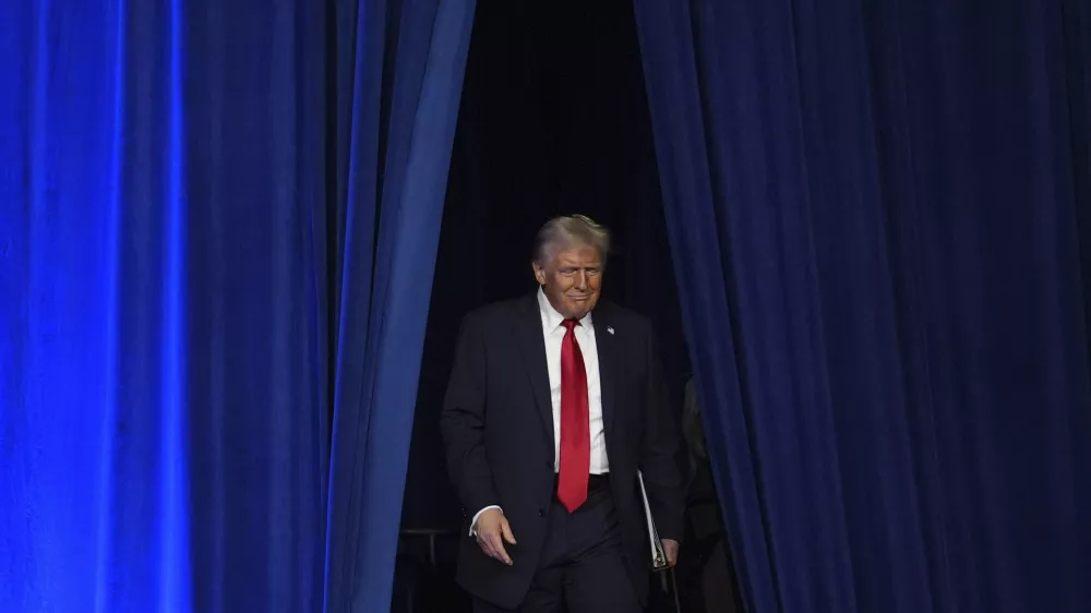 Republican presidential nominee former President Donald Trump arrives at an election night watch party at the Palm Beach Convention Center, Wednesday, Nov. 6, 2024, in West Palm Beach, Fla. (AP Photo/Evan Vucci)