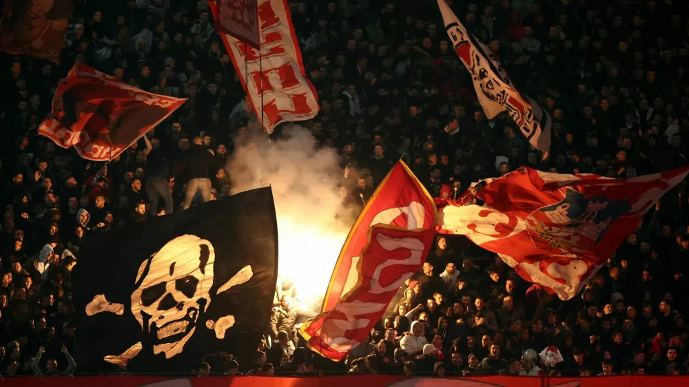 Soccer Football - Champions League - Crvena Zvezda v FC Barcelona - Rajko Mitic Stadium, Belgrade, Serbia - November 6, 2024 General view of Crvena Zvezda fans with flares in the stands REUTERS/Marko Djurica