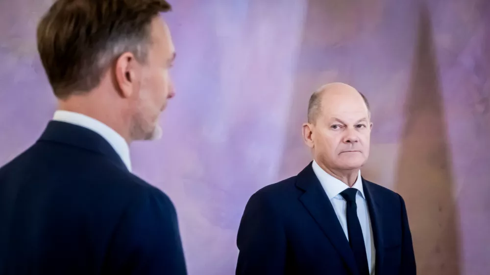 07 November 2024, Berlin: German Chancellor Olaf Scholz (R) looks at former Minister of Finance Christian Lindner during his dismissal ceremony at Bellevue Palace. Photo: Christoph Soeder/dpa