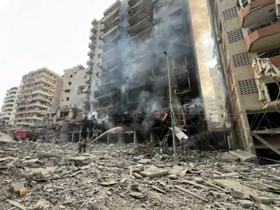 Firefighters work at a damaged site, in the aftermath of Israeli strikes, amid the ongoing hostilities between Hezbollah and Israeli forces, in Beirut's southern suburbs, Lebanon, November 9, 2024. REUTERS/Haider Kadhim   TPX IMAGES OF THE DAY