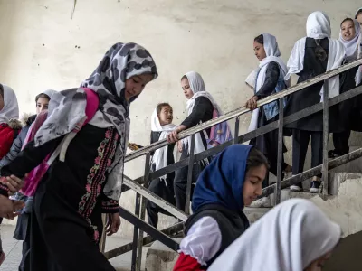 Girls attend school on the first day of the new school year, in Kabul, Afghanistan, on Saturday, March 25, 2023. The new Afghan educational year started, but high school remained closed for girls for the second year after Taliban returned to power in 2021. (AP Photo/Ebrahim Noroozi)