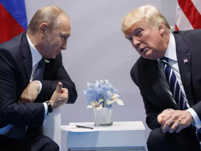 ﻿FILE - In this file photo taken on Friday, July 7, 2017, U.S. President Donald Trump, right, meets with Russian President Vladimir Putin at the G-20 Summit in Hamburg, Germany. The Kremlin said Trump called Putin to congratulate him on re-election, and White House press secretary Sarah Huckabee Sanders confirmed that Trump spoke with Putin Tuesday March 20, 2018. (AP Photo/Evan Vucci)