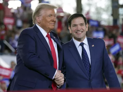 FILE - Republican presidential nominee former President Donald Trump greets Sen. Marco Rubio, R-Fla., during a campaign rally at J.S. Dorton Arena, Nov. 4, 2024, in Raleigh, N.C. (AP Photo/Evan Vucci, File)