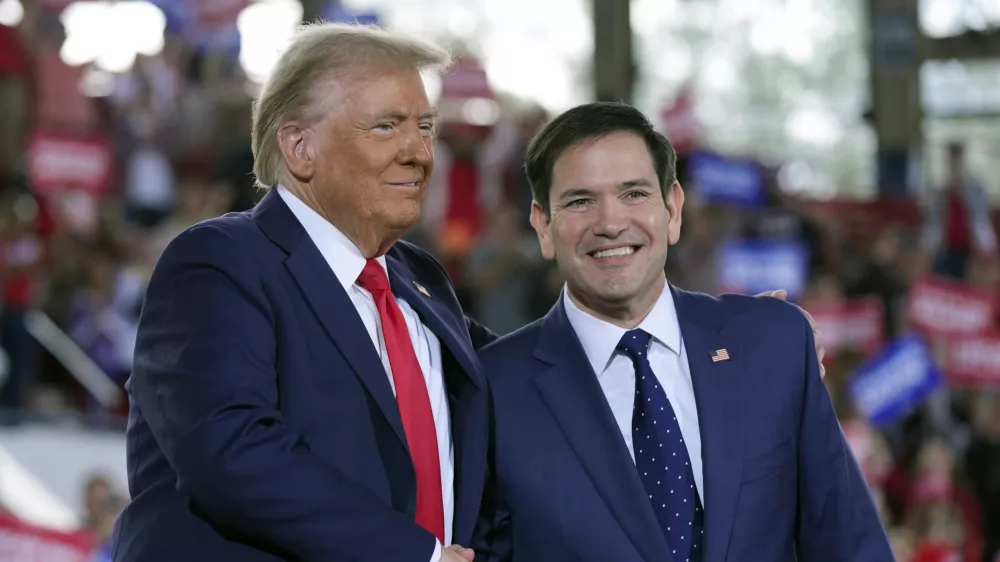 FILE - Republican presidential nominee former President Donald Trump greets Sen. Marco Rubio, R-Fla., during a campaign rally at J.S. Dorton Arena, Nov. 4, 2024, in Raleigh, N.C. (AP Photo/Evan Vucci, File)