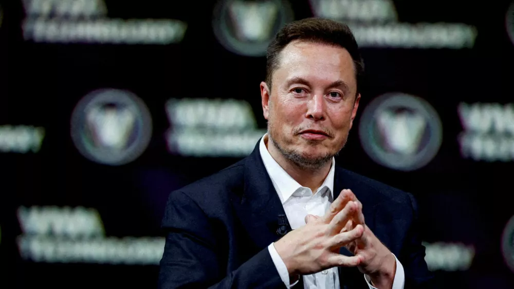 FILE PHOTO: Chief Executive Officer of SpaceX and Tesla and owner of Twitter, gestures as he attends the Viva Technology conference dedicated to innovation and startups at the Porte de Versailles exhibition centre in Paris, France, June 16, 2023. REUTERS/Gonzalo Fuentes/File Photo