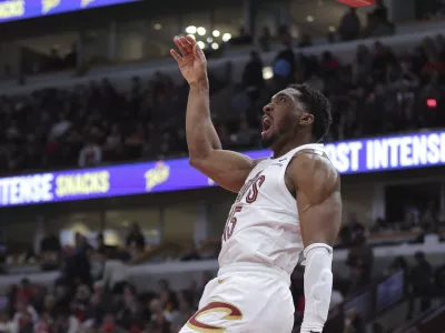 Cleveland Cavaliers guard Donovan Mitchell watches his missed slam dunk against the Chicago Bulls during the second half an NBA basketball game, Monday, Nov. 11, 2024, in Chicago. (AP Photo/Melissa Tamez)