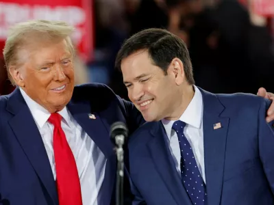 Republican presidential nominee and former U.S. President Donald Trump and Senator Marco Rubio (R-FL) react during a campaign event at Dorton Arena, in Raleigh, North Carolina, U.S. November 4, 2024. REUTERS/Jonathan Drake