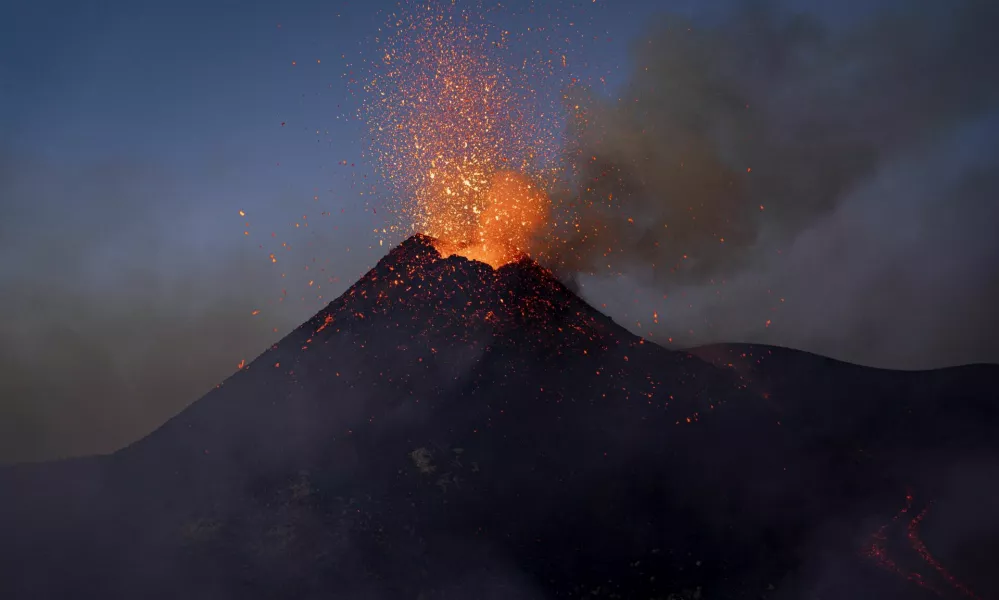 Lava rises from a crater of Mount Etna, Europe's most active volcano, Italy July 2, 2024. REUTERS/Etna Walk/Giuseppe Di Stefano