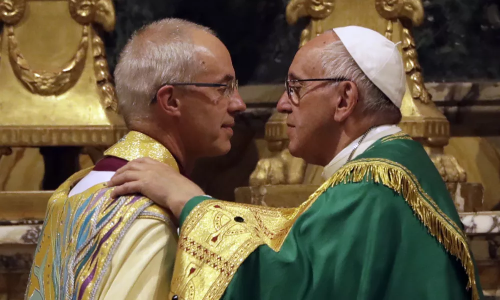 ﻿Pope Francis, right, greets the archbishop of Canterbury, Justin Welby, during vespers prayers in the church of San Gregorio al Celio, in Rome, Wednesday, Oct. 5, 2016. Francis joined the archbishop of Canterbury, Justin Welby, for a vigil prayer service Wednesday at Rome's church of St. Gregory. The church is named for the 6th century pope who dispatched missionaries to England to spread Christianity. (AP Photo/Gregorio Borgia)