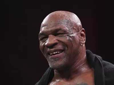 Mike Tyson reacts after working out ahead of his boxing match against Jake Paul, Tuesday, Nov. 12, 2024, in Irving, Texas. (AP Photo/Julio Cortez)