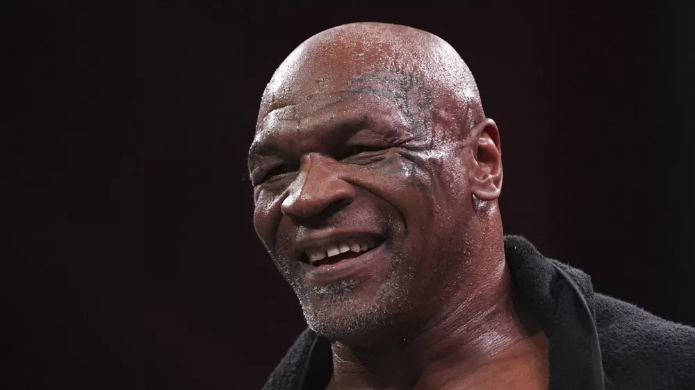 Mike Tyson reacts after working out ahead of his boxing match against Jake Paul, Tuesday, Nov. 12, 2024, in Irving, Texas. (AP Photo/Julio Cortez)