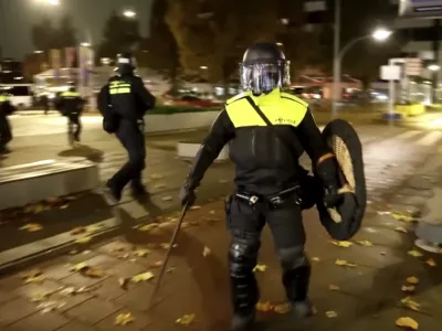 In this image taken from video, police officers patrol in riot gear on the streets of Amsterdam, Monday Nov. 11, 2024, as the city is facing tensions following violence last week. (AP Photo)