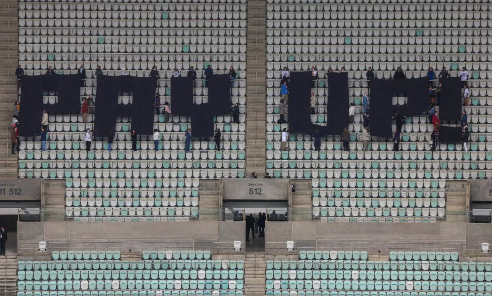 Activists hold a protest calling on developed nations to provide financing to fight climate change at the Olympic Stadium housing the United Nations climate change conference COP29 in Baku, Azerbaijan November 14, 2024. REUTERS/Murad Sezer   TPX IMAGES OF THE DAY