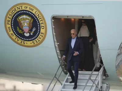 U.S. President Joe Biden deplanes in Lima, Peru, to attend the Asia-Pacific Economic Cooperation (APEC) summit, in Lima, Peru,Thursday, Nov. 14, 2024. (AP Photo/Guadalupe Pardo)