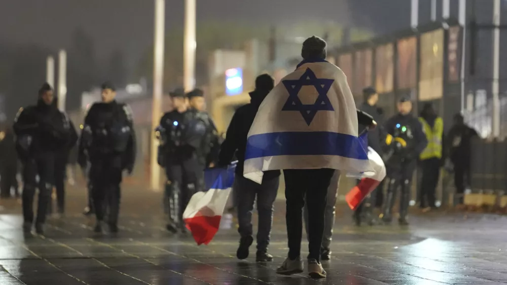 Soccer supporters leave after the Nations League soccer match France against Israel outside the Stade de France stadium, Thursday, Nov. 14, 2024 in Saint-Denis, outside Paris. (AP Photo/Christophe Ena)