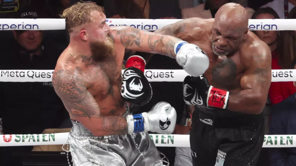 Nov 15, 2024; Arlington, Texas, UNITED STATES; Mike Tyson (black gloves) fights Jake Paul (silver gloves) at AT&T Stadium. Mandatory Credit: Kevin Jairaj-Imagn Images