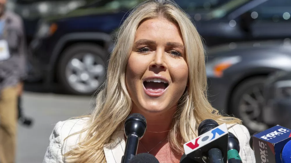 FILE - Karoline Leavitt speaks to the news media across the street from Republican presidential nominee former President Donald Trump's criminal trial in New York, May 28, 2024. (AP Photo/Ted Shaffrey, File)