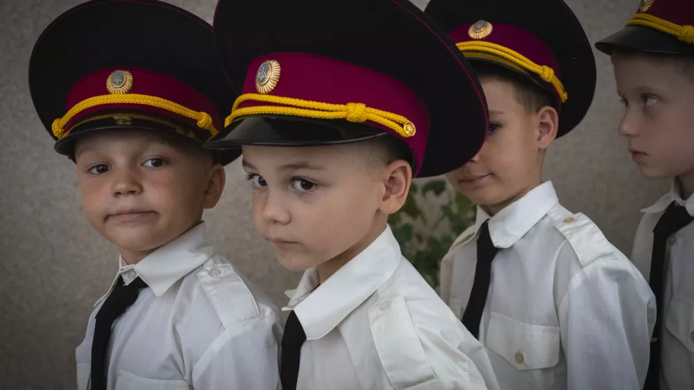 Young cadets get ready for a ceremony in a cadet lyceum on the first day at school in Kyiv, Ukraine, Monday, Sept. 2, 2024. (AP Photo/Efrem Lukatsky)