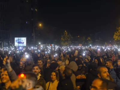 People light their mobile phones during a protest in Novi Sad, Serbia, Tuesday, Nov. 5, 2024. (AP Photo/Marko Drobnjakovic)