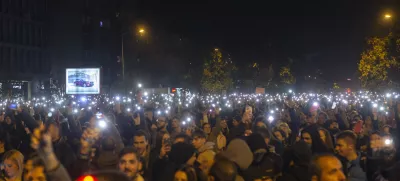 People light their mobile phones during a protest in Novi Sad, Serbia, Tuesday, Nov. 5, 2024. (AP Photo/Marko Drobnjakovic)