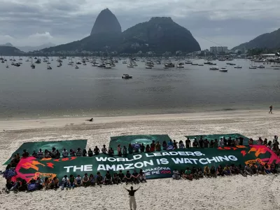 A drone view shows banners with the faces of activist Angela Mendes, daughter of late environmentalist Chico Mendes, Quilombo's leader Kelly Araujo and indigenous leader Txai Surui, ahead of the G20 Summit in Praia de Botafogo beach in Rio de Janeiro, Brazil November 17, 2024. REUTERS/Pilar Olivares