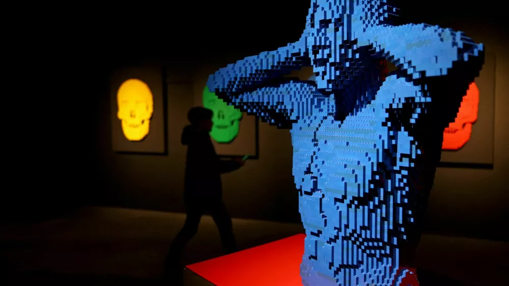 A child visits the exhibition 'Art of the Brick' by U.S. artist Nathan Sawaya, a contemporary artist who takes LEGO into the art world as a medium, in Berlin, Germany, October 16, 2024. REUTERS/Lisi Niesner   TPX IMAGES OF THE DAY