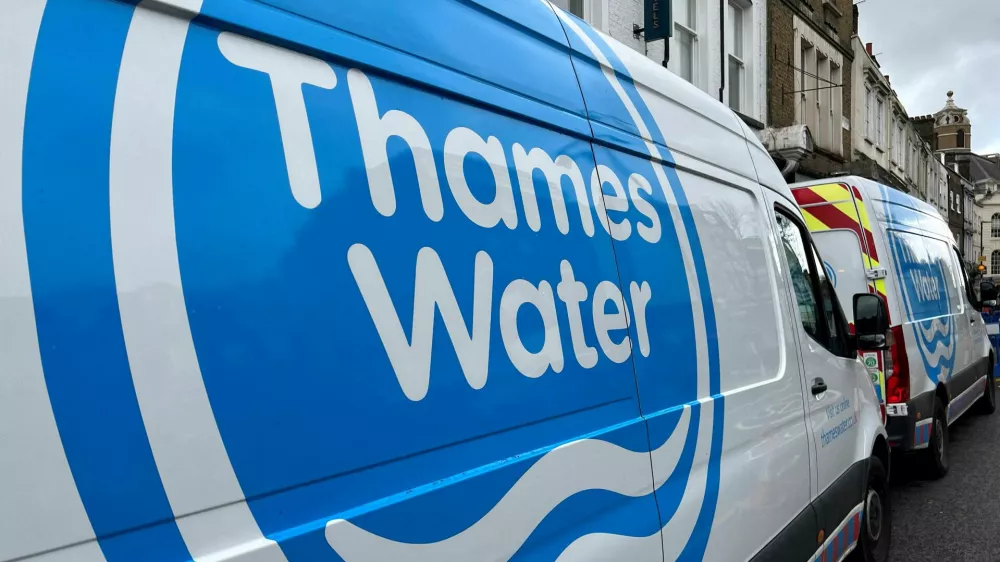 FILE PHOTO: Thames Water vans are parked on a road as repair and maintenance work takes place, in London, Britain, April 3, 2024. REUTERS/Toby Melville/File Photo