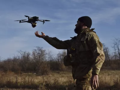 In this photo provided by the Ukraine's 65th Mechanised Brigade press service on Nov. 19, 2024, a Ukrainian soldier launches a drone during a training at a polygon in Zaporizhzhia region, Ukraine. (Andriy Andriyenko/Ukraine's 65th Mechanised Brigade via AP)