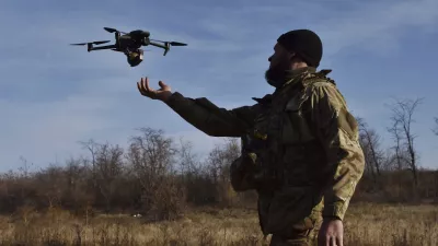 In this photo provided by the Ukraine's 65th Mechanised Brigade press service on Nov. 19, 2024, a Ukrainian soldier launches a drone during a training at a polygon in Zaporizhzhia region, Ukraine. (Andriy Andriyenko/Ukraine's 65th Mechanised Brigade via AP)