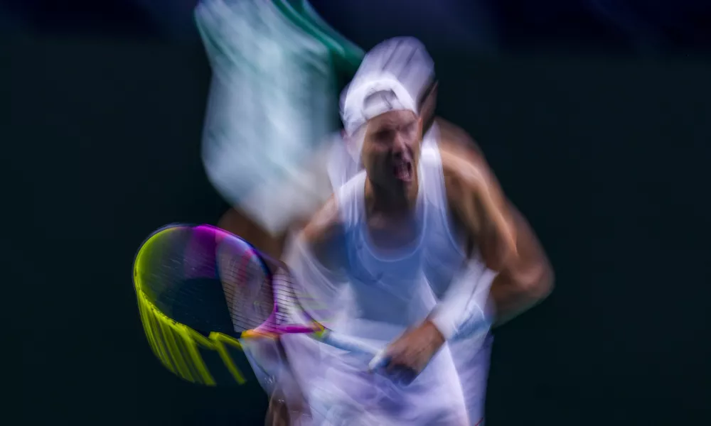 In this image taken with a slow shutter speed, Spain's tennis player Rafael Nadal gestures during a training session at the Martin Carpena Sports Hall, in Malaga, southern Spain, on Friday, Nov. 15, 2024. (AP Photo/Manu Fernandez)