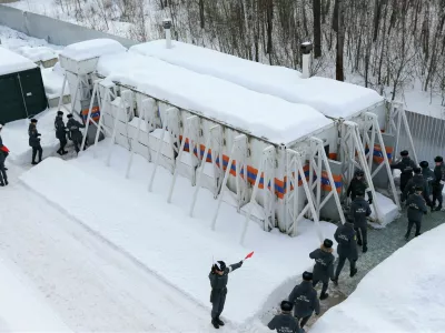 Emergency personnel walk into radiation-resistant mobile bomb shelters in Nizhny Novgorod region, Russia February 10, 2023. Russian Scientific Research Institute for Civil Defence and Emergencies of EMERCOM/Handout via REUTERS ATTENTION EDITORS - THIS IMAGE WAS PROVIDED BY A THIRD PARTY. NO RESALES. NO ARCHIVES. MANDATORY CREDIT