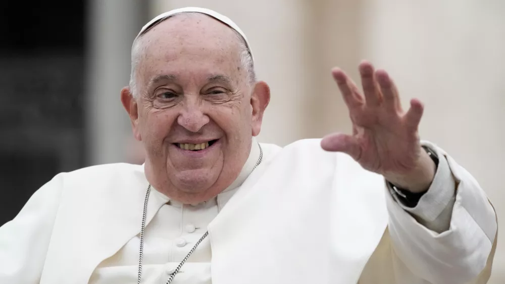 Pope Francis waves as he leaves after his weekly general audience in St. Peter's Square at The Vatican, Wednesday, Nov.20, 2024. (AP Photo/Gregorio Borgia)