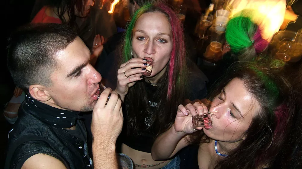 People slam shots of vodka to celebrate during a New Years party in a bar in downtown Prague, Czech Republic, Dec. 31, 2004. Drinking is a national pastime in this beer-loving country, but authorities and health experts concede they've got trouble on their hands: a growing number of underaged youths, some as young as 10, who are hitting the bottle regularly. (AP Photo/Petr David Josek)