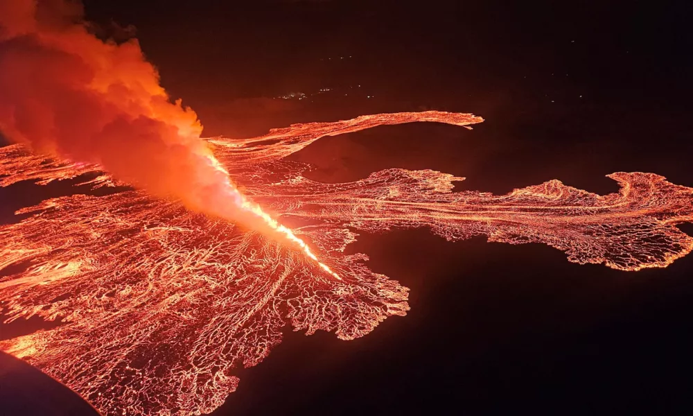 Lava spurts and flows after the eruption of a volcano in the Reykjanes Peninsula near Grindavik, Iceland, in this handout picture released on November 21, 2024. Civil Protection of Iceland/Handout via REUTERS  THIS IMAGE HAS BEEN SUPPLIED BY A THIRD PARTY. NO RESALES. NO ARCHIVES. MANDATORY CREDIT.