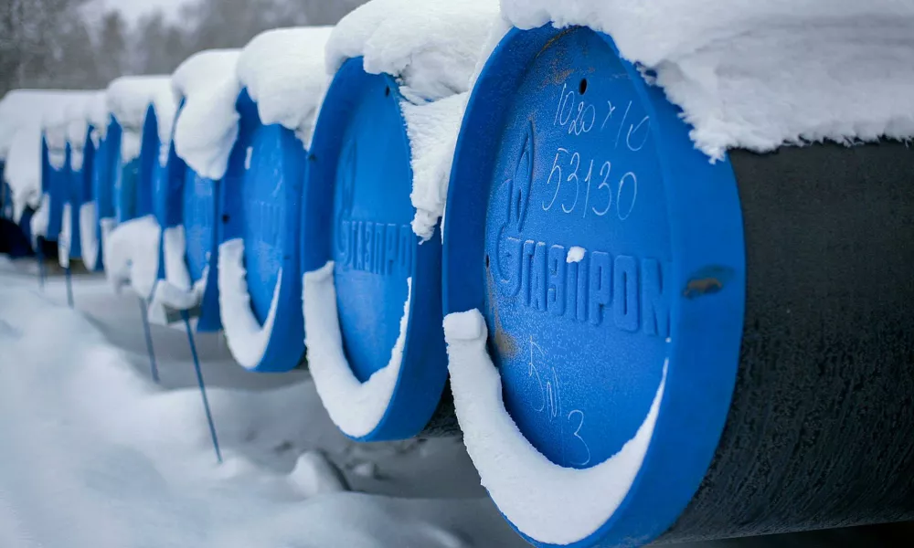 2BREMR0 Barnaul, Russia-13.12.2018: pipes for gasification with the inscription Gazprom lie in an open warehouse in winter.