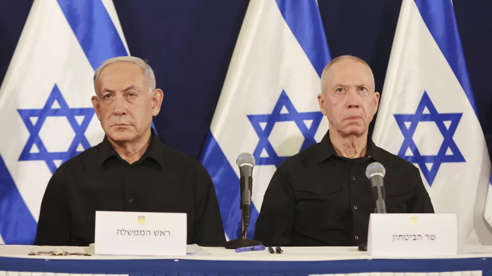 FILE - Israeli Prime Minister Benjamin Netanyahu, left, and Defense Minister Yoav Gallant attend a press conference in the Kirya military base in Tel Aviv, Israel, Saturday, Oct. 28, 2023. (Abir Sultan/Pool Photo via AP, File)