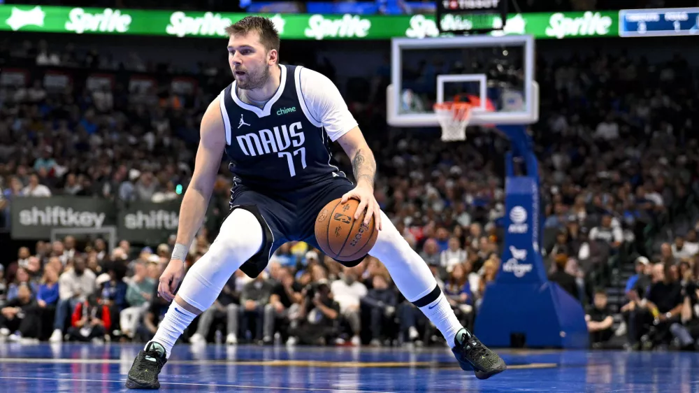 Nov 19, 2024; Dallas, Texas, USA; Dallas Mavericks guard Luka Doncic (77) brings the ball up court against the New Orleans Pelicans during the second half at the American Airlines Center. Mandatory Credit: Jerome Miron-Imagn Images