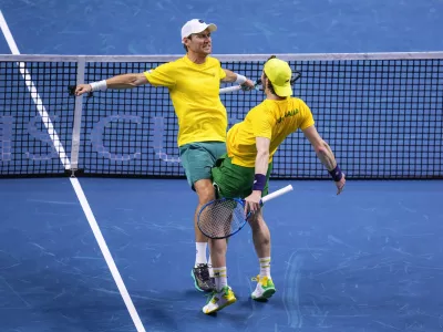 Australia's Matthew Ebden, left, and Jordan Thompson celebrate their victory against Tommy Paul and Ben Shelton of the United States, during their doubles tennis quarterfinal Davis Cup match at the Martin Carpena Sports Hall, in Malaga, southern Spain, on Thursday, Nov. 21, 2024. (AP Photo/Manu Fernandez)