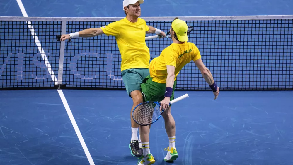 Australia's Matthew Ebden, left, and Jordan Thompson celebrate their victory against Tommy Paul and Ben Shelton of the United States, during their doubles tennis quarterfinal Davis Cup match at the Martin Carpena Sports Hall, in Malaga, southern Spain, on Thursday, Nov. 21, 2024. (AP Photo/Manu Fernandez)