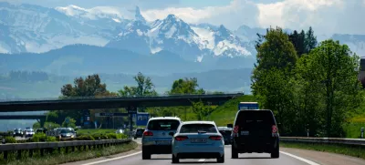 MKHR75 Highway traffic with a mountain range in the background, Switzerland, Europe