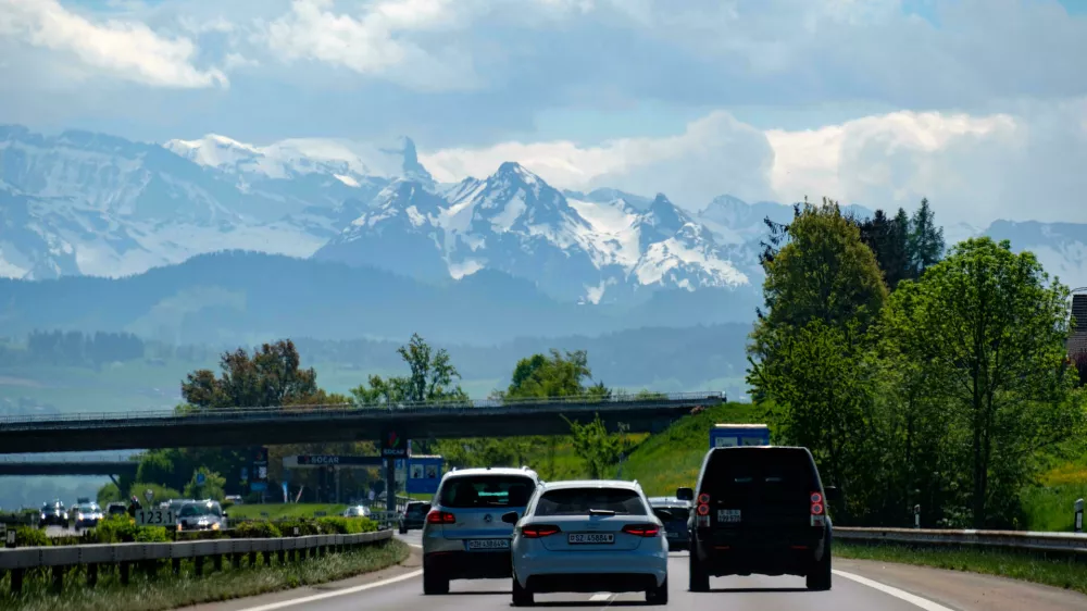 MKHR75 Highway traffic with a mountain range in the background, Switzerland, Europe